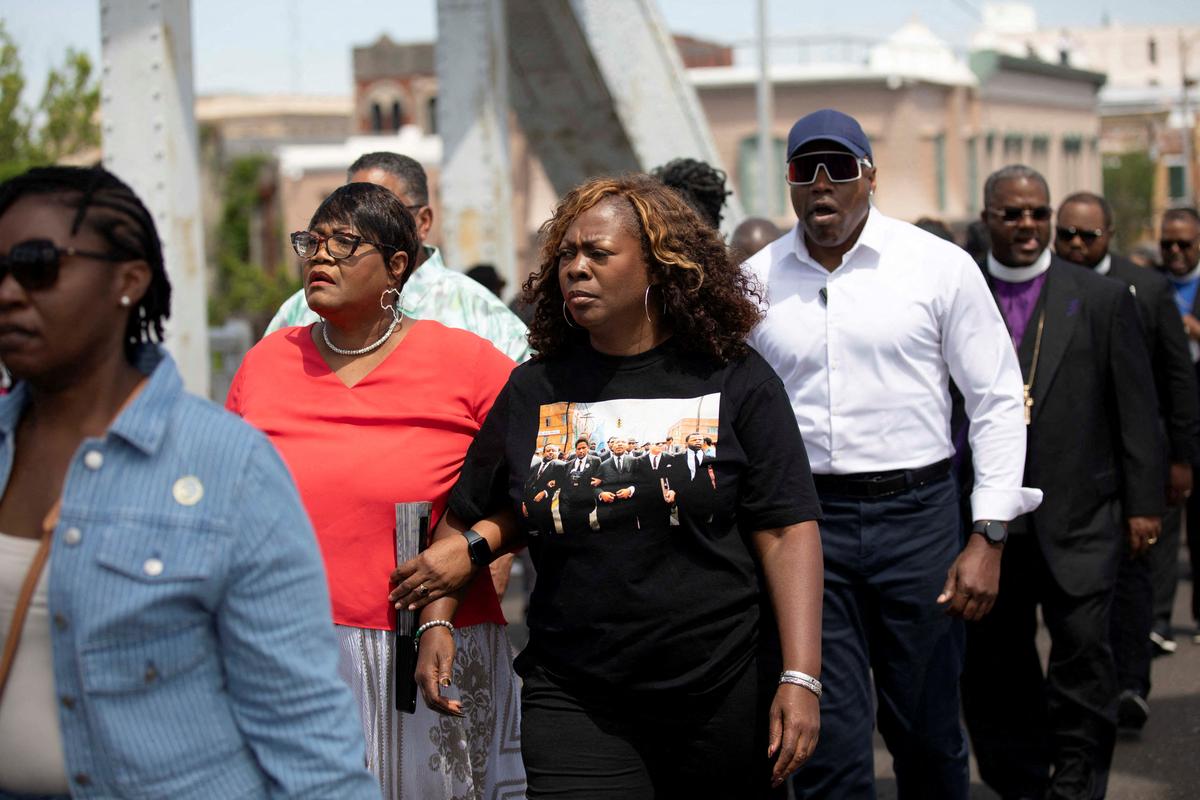FILE PHOTO: LaTosha Brown, founder of Black Voters Matter, marches across the Edmund Pettus Bridge during the National Day of Action: All Roads Lead to the South march against redistricting efforts, in Selma, Alabama, U.S., May 16, 2026.  REUTERS/Alyssa Pointer/File Photo