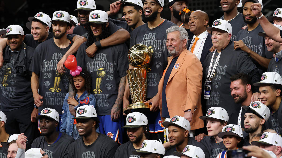 Jun 13, 2026; San Antonio, Texas, USA; New York Knicks ownership, front office, players, and coaches pose with the Larry O'Brien championship trophy during the trophy presentation after game five of the 2026 NBA Finals against the San Antonio Spurs at Frost Bank Center. Mandatory Credit: Geoff Burke-Imagn Images