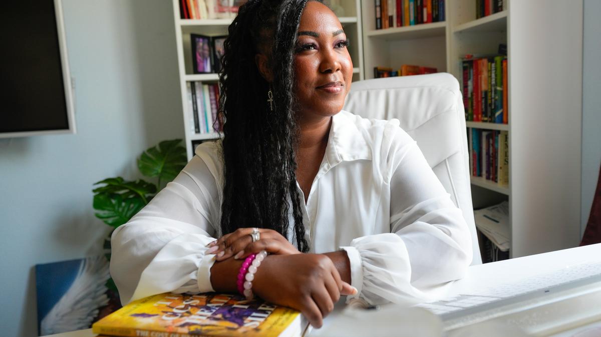 Ashley McGirt-Adair, photographed at her home in Spring Valley, is a licensed therapist and the author of “The Cost of Living in Silence: Navigating Racial Trauma and the Call for Culturally Responsive Care.”  (Nelvin C. Cepeda / The San Diego Union-Tribune)