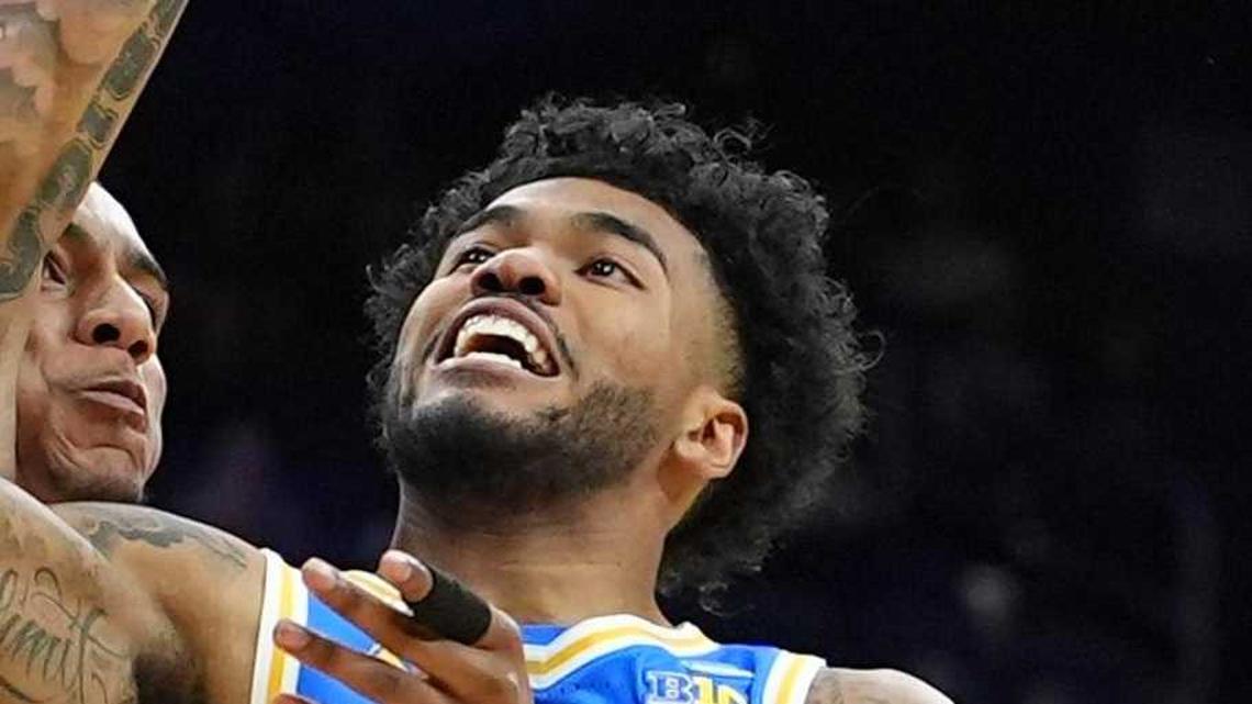  Mar 22, 2026; Philadelphia, PA, USA; UCLA Bruins guard Donovan Dent (2) shoots the ball against the UConn Huskies in the first half during a second round game of the men's 2026 NCAA Tournament at Xfinity Mobile Arena. Mandatory Credit: Kyle Ross-Imagn Images | Kyle Ross-Imagn Images 