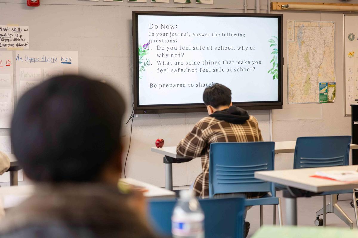  Students work through a journaling prompt in a multilingual learner reading class at Winooski High School. Credit: Oliver Parini for The Hechinger Report