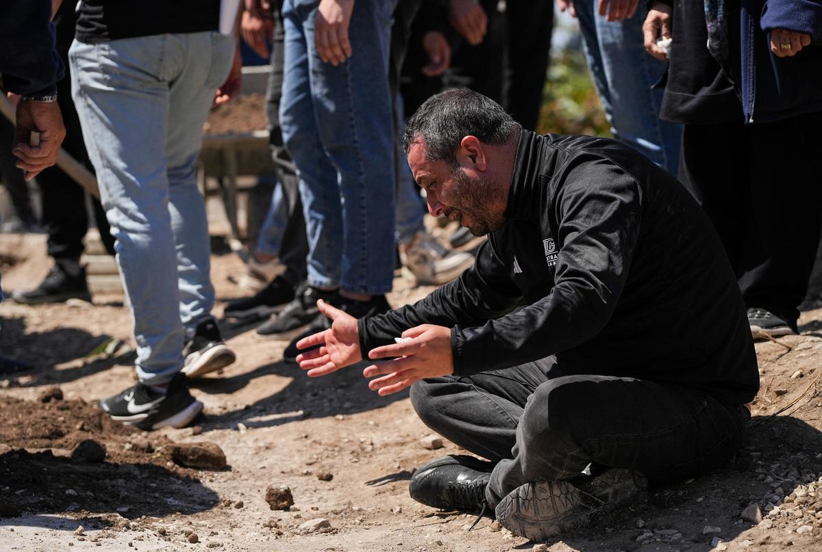 A mourner reacts during the funeral of four people killed in an Israeli strike, in Ansariyeh, Lebanon, May 8, 2026. REUTERS/Stringer