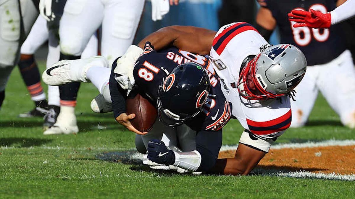  Nov 10, 2024; Chicago, Illinois, USA; New England Patriots defensive end Deatrich Wise Jr. (91) sacks Chicago Bears quarterback Caleb Williams (18) during the second half at Soldier Field. Mandatory Credit: Mike Dinovo-Imagn Images | Mike Dinovo-Imagn Images 
