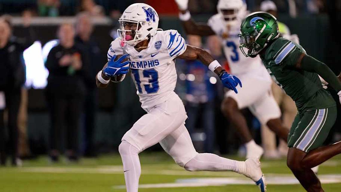  Nov 28, 2024; New Orleans, Louisiana, USA; Memphis Tigers running back Greg Desrosiers Jr. (13) breaks away from the Tulane Green Wave finishing off the play with a touchdown during the second quarter at Yulman Stadium. Mandatory Credit: Matthew Hinton-Imagn Images | Matthew Hinton-Imagn Images 