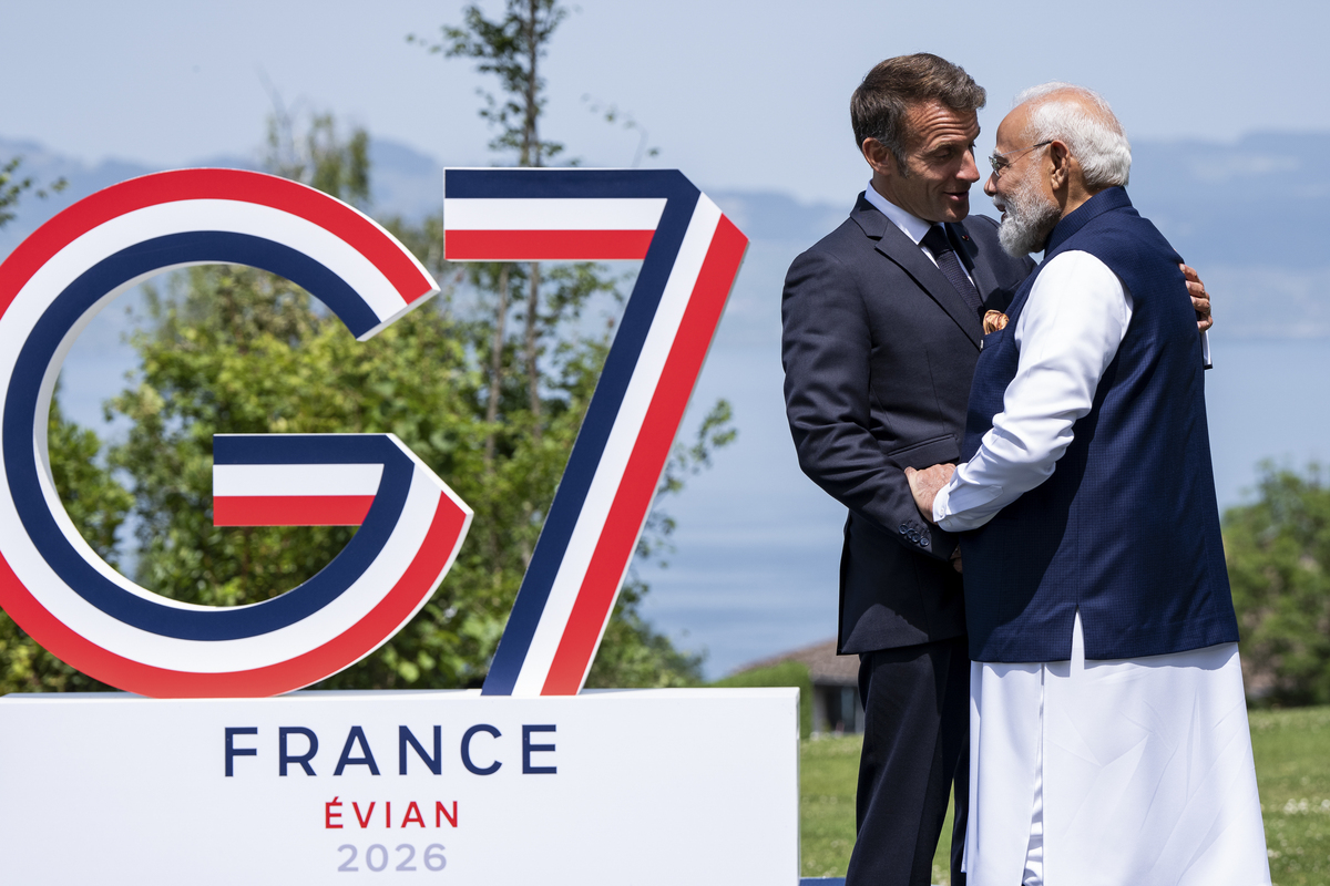 President Emmanuel Macron of France greets Prime Minister Narendra Modi of India as world leaders gather for an official photo at the G7 Summit in Evian-les-Bains, France, June 16, 2026. (Haiyun Jiang/The New York Times)