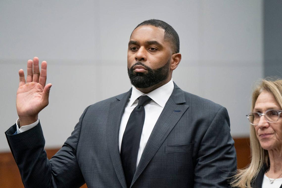  Former University of Michigan head football coach Sherrone Moore, left, is sworn in with his attorney Ellen Michaelsat right before he takes a plea in front of Judge J. Cedric Simpson at the 14A-1 District Court in Ann Arbor on Friday, March 6, 2026. 
