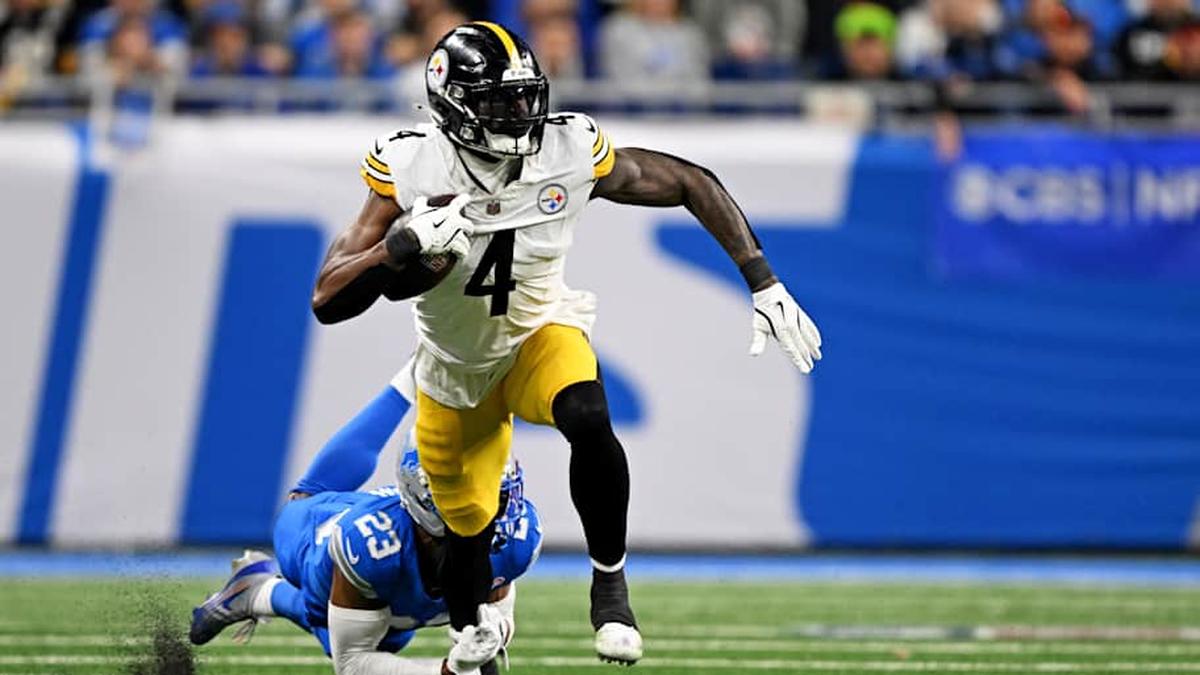  Dec 21, 2025; Detroit, Michigan, USA; Detroit Lions cornerback Rock Ya-Sin (23) tackles Pittsburgh Steelers wide receiver DK Metcalf (4) during the fourth quarter at Ford Field. | Lon Horwedel-Imagn Images 