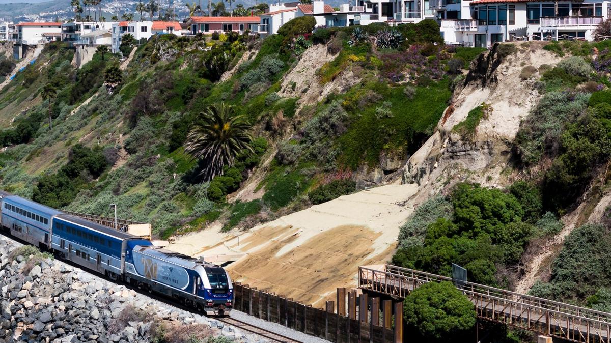 An Amtrak Pacific Surfliner train travels south through San Clemente. America’s primitive rail system is an international embarrassment.