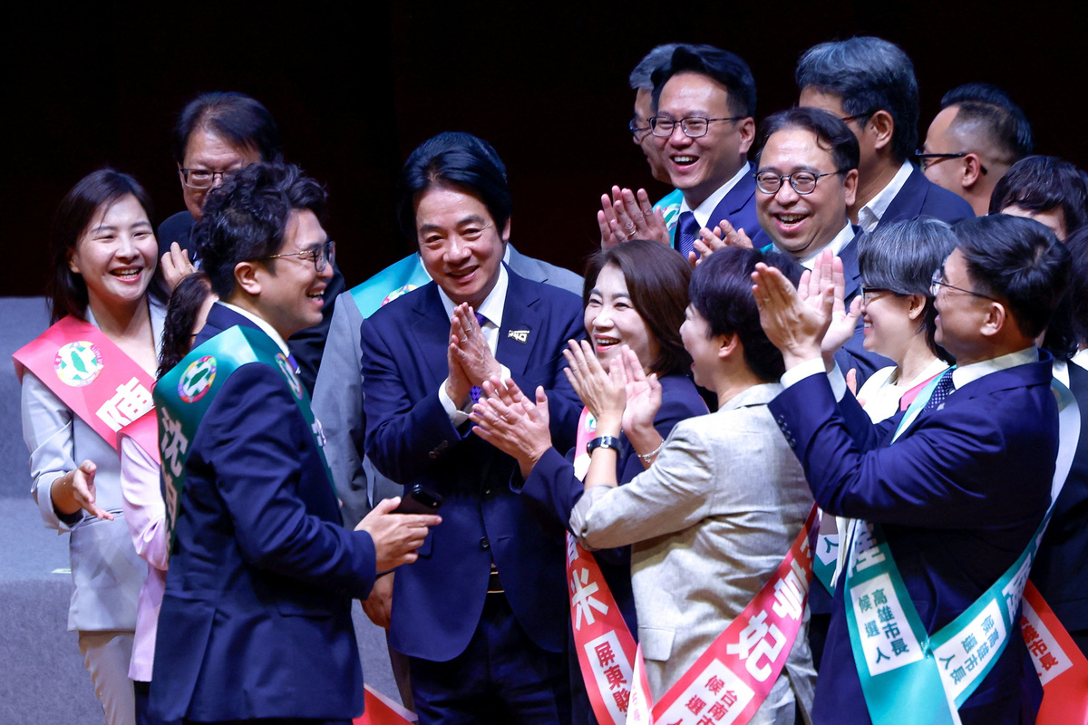 Taiwan President Lai Ching-te applauds after posing for a group selfie with candidates for mayoral and county chief elections during the annual congress of the ruling Democratic Progressive Party (DPP) in Taipei, Taiwan, July 19, 2026. REUTERS/Ann Wang
