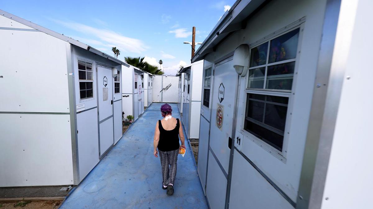 Cathy Fuller, 62, walks to her unit at Alexandria Park Tiny Home Village in North Hollywood on Feb. 6, 2026. Alexandria Park Tiny Home Village is Hope the Mission's second-largest Tiny Home Facility in Los Angeles. (Genaro Molina/Los Angeles Times/TNS)