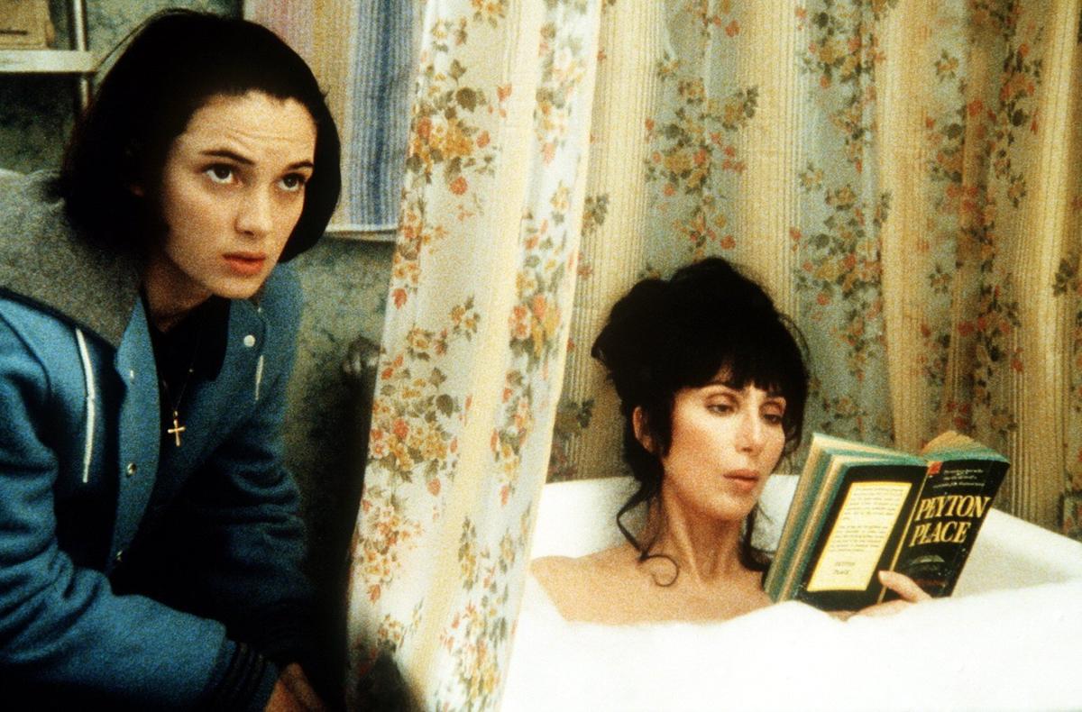 Cher played Mrs. Flax in the iconic movie ‘Mermaids.’ Here, her character famously reads the scandalous ‘Peyton Place’ by Grace Metalious in the bathtub.Orion Pictures Corporation / MovieStillsDB.com