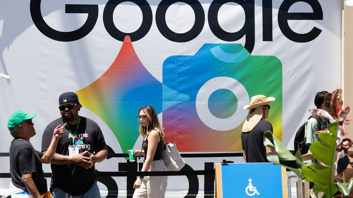 Attendees walk past a google sign at Google I/O on May 19, 2026, in Mountain View, California. The two day developers conference highlights Google's new products and technologies including their AI developments. (Benjamin Fanjoy/Getty Images/TNS)