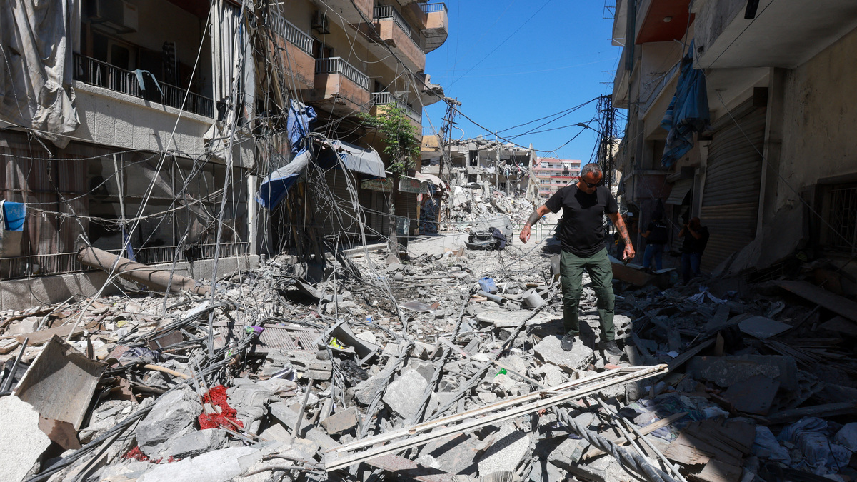 A man walks on rubble at the site an Israeli strike in Tyre, Lebanon, June 12, 2026. REUTERS/Aziz Taher