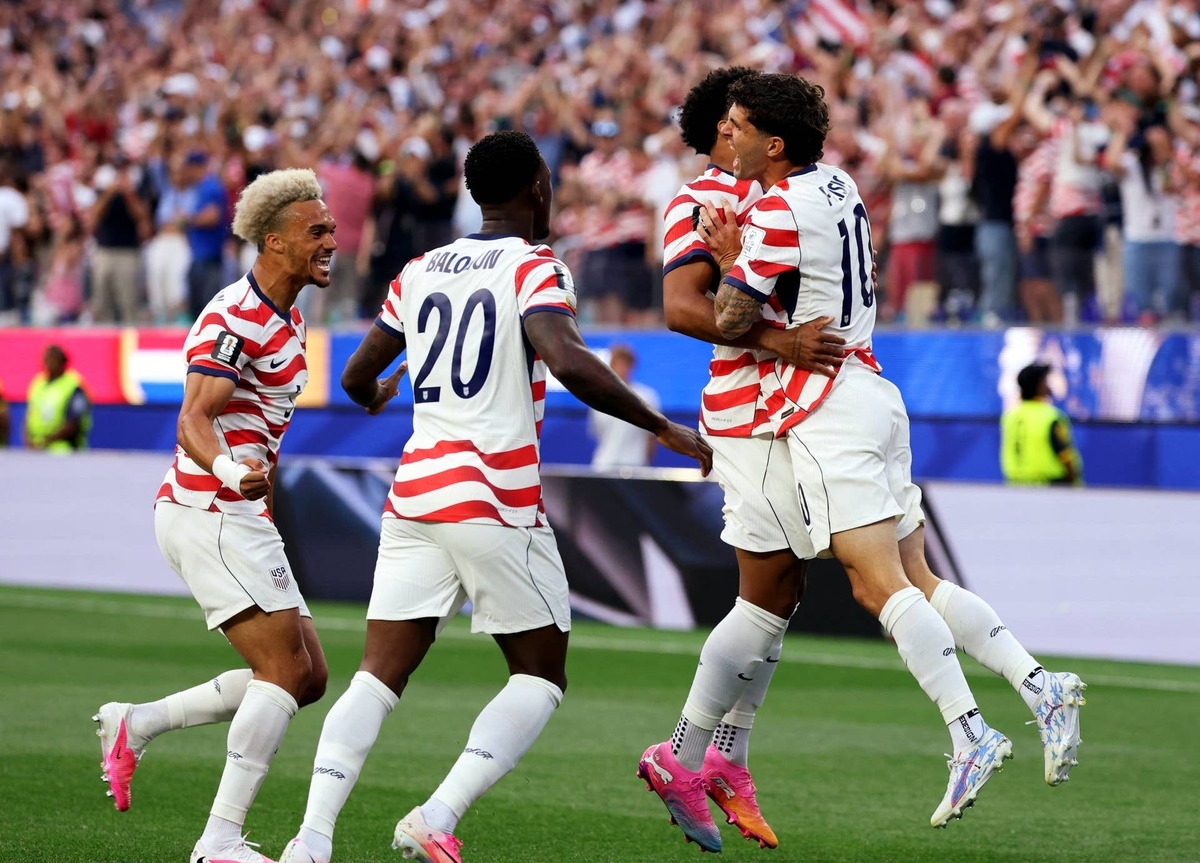  June 12, 2026; Inglewood, California, U.S.; Christian Pulisic of the U.S. celebrates with teammates their first goal, an own goal scored by Paraguay's Damian Bobadilla. Mandatory Credit: Kiyoshi Mio-Imagn Images