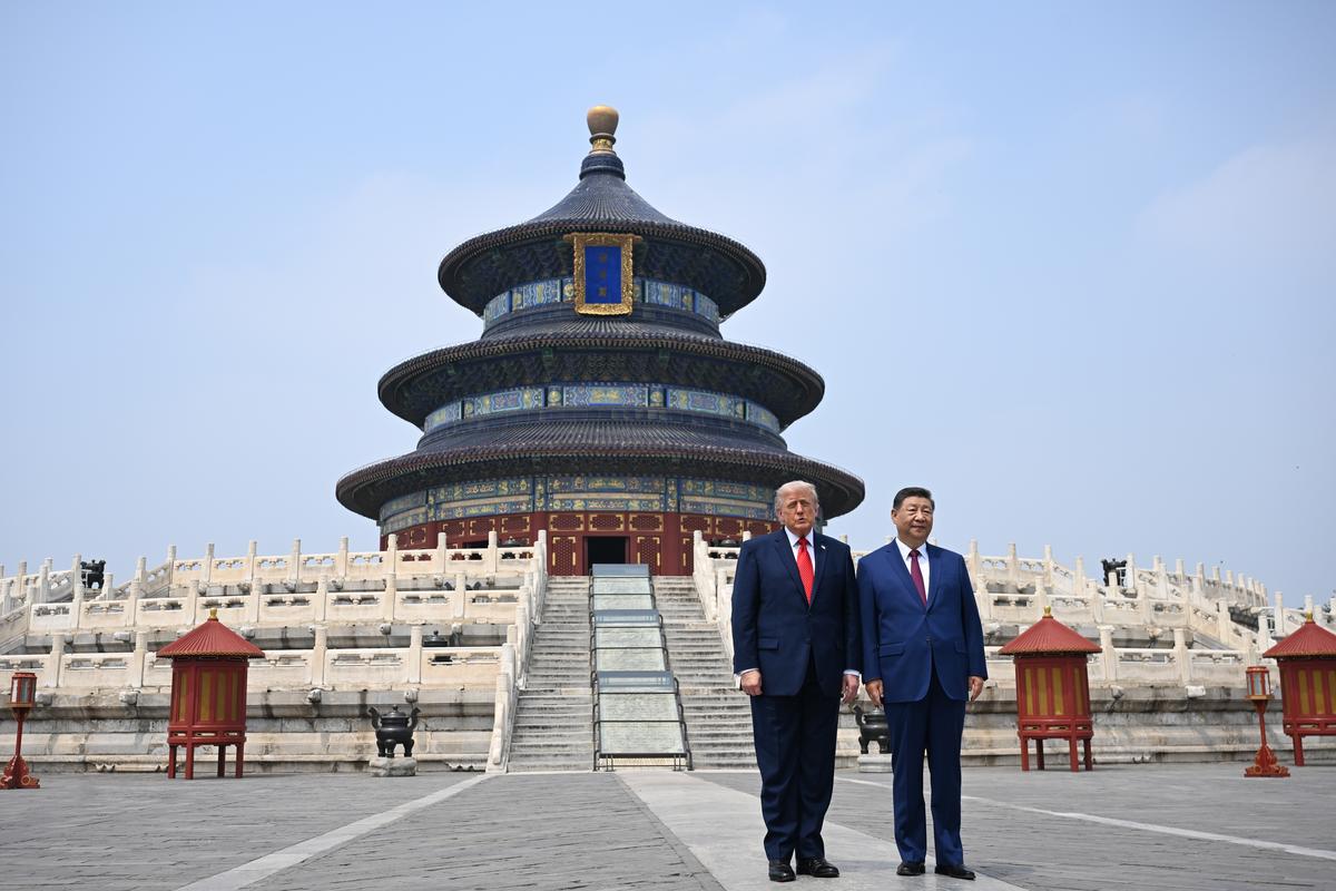 President Donald Trump and President Xi Jinping of China visit the Temple of Heaven in Beijing during their two-day summit, on Thursday, May 14, 2026. During the first U.S. presidential visit to China in nearly a decade, Xi delivered a warning on Taiwan, saying that the issue, if handled poorly, could lead to conflict and "an extremely dangerous situation." (Kenny Holston/The New York Times)..
