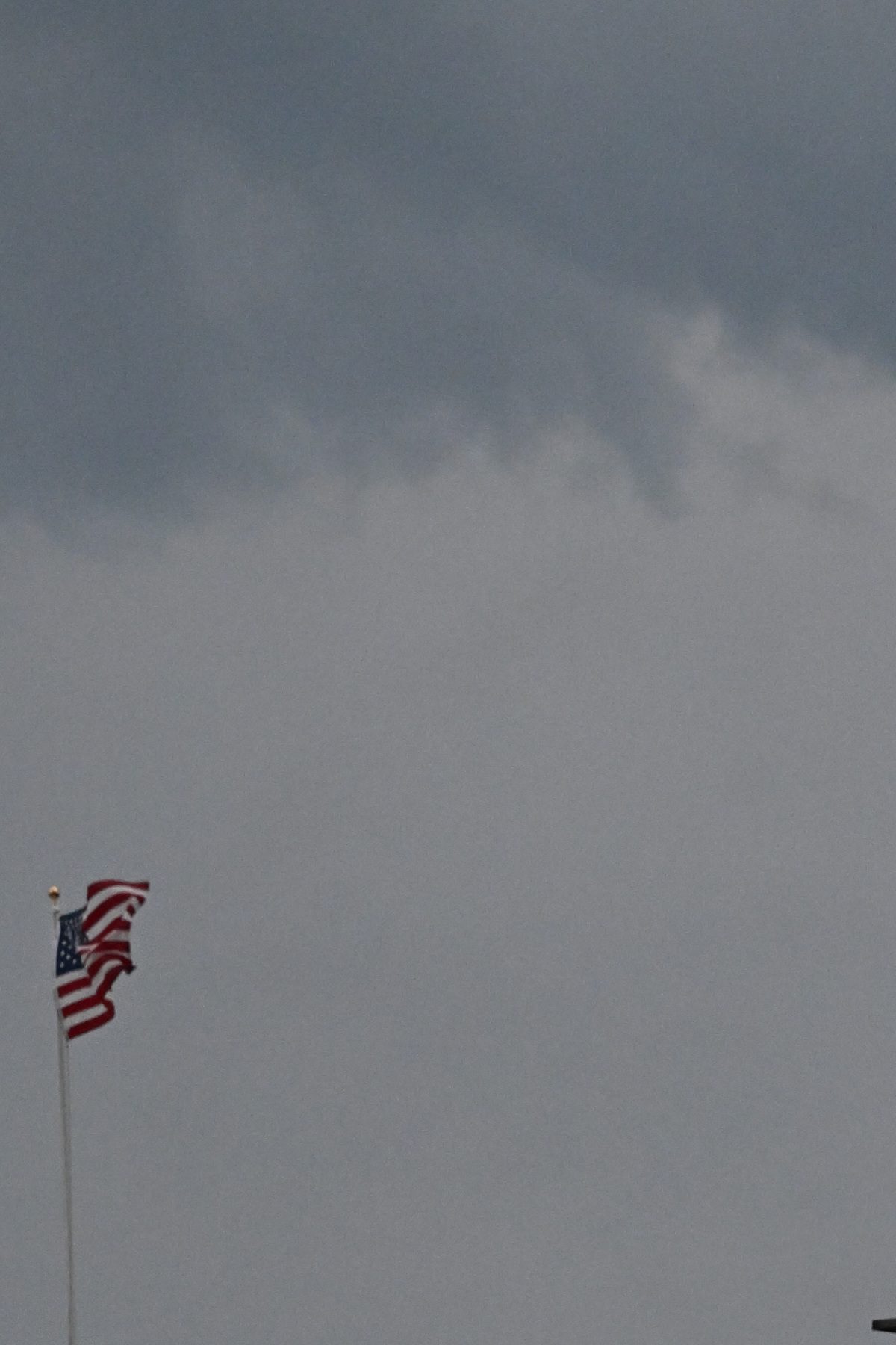 A sign urges America 250 attendees to evacuate due to severe weather approaching the National Mall in Washington, on July 4, 2026. Federal and local officials scrambled to safely evacuate thousands of people from the National Mall and into nearby Smithsonian museums and federal buildings, according to multiple officials. (Kenny Holston/The New York Times)