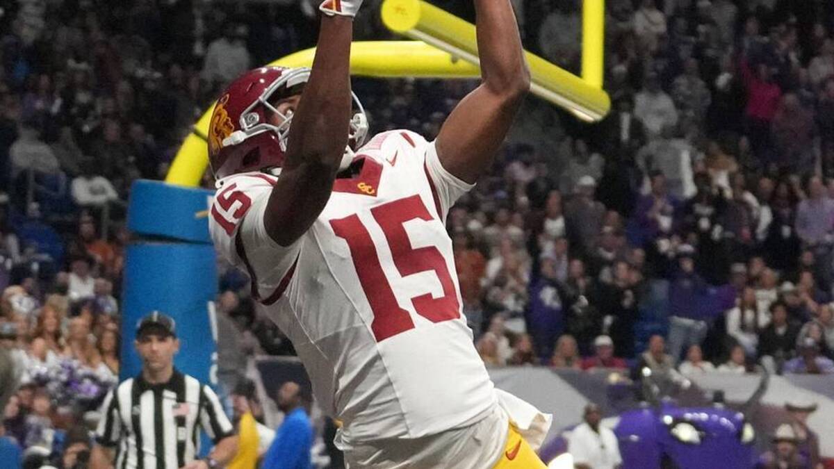  Dec 30, 2025; San Antonio, TX, USA; Southern California Trojans wide receiver Jaden Richardson (15) attempts to catch the ball against TCU Horned Frogs safety Bud Clark (21) and cornerback Channing Canada (7) during the Alamo Bowl at Alamodome. Mandatory Credit: Kirby Lee-Imagn Images | Kirby Lee-Imagn Images 
