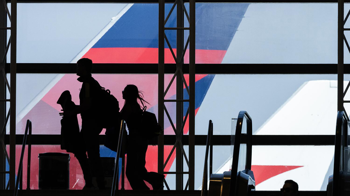 Passengers head to their gate at the Tom Bradley International Terminal at Los Angeles International Airport in Los Angeles, on Friday, March 27, 2026.