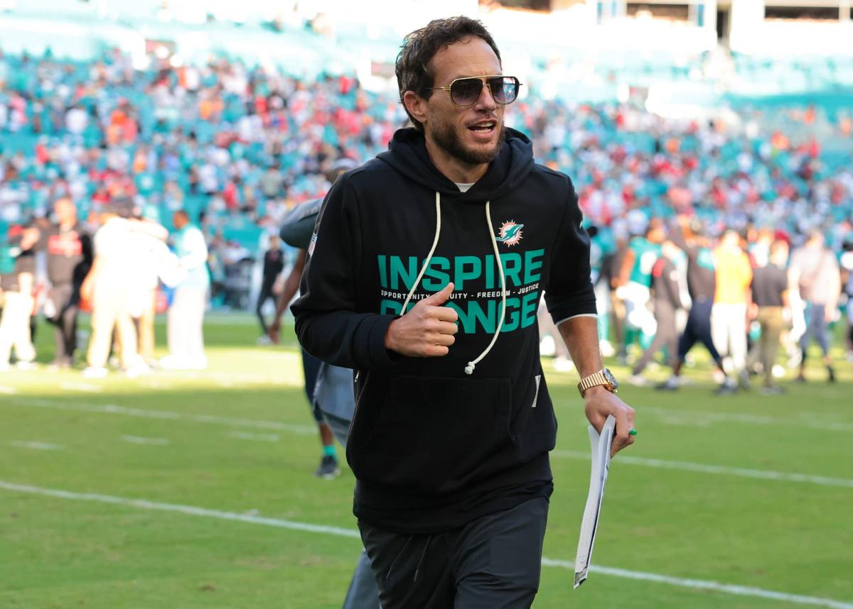  Dec 28, 2025; Miami Gardens, Florida, USA; Miami Dolphins head coach Mike McDaniel runs off the field following a win over the Tampa Bay Buccaneers at Hard Rock Stadium. Mandatory Credit: Sam Navarro-Imagn Images 