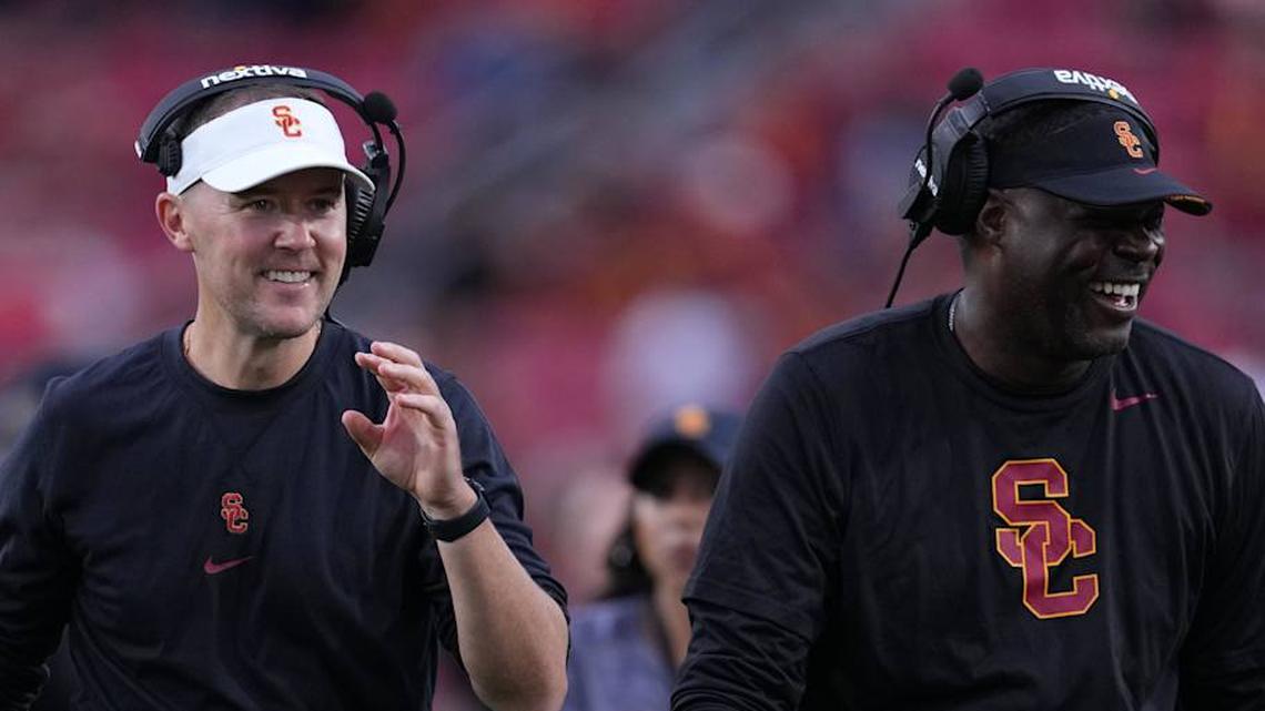  Sep 2, 2023; Los Angeles, California, USA; Southern California Trojans head coach Lincoln Riley (leff) and wide receivers coach Dennis Simmons react against the Nevada Wolf Pack in the second half at United Airlines Field at Los Angeles Memorial Coliseum. Mandatory Credit: Kirby Lee-Imagn Images | Kirby Lee-Imagn Images 