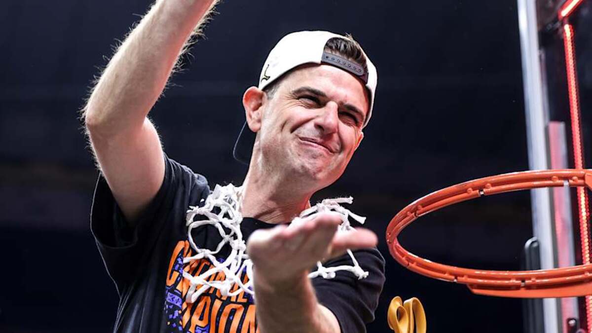  Florida Gators head coach Todd Golden chomps after leading the Florida Gators to its third championship in program history. | Kyle Lander / Gators Illustrated 