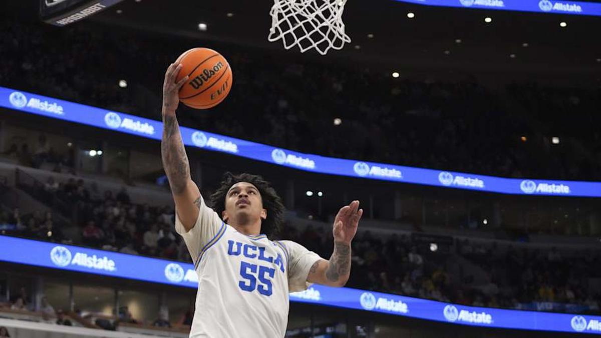  Mar 14, 2026; Chicago, IL, USA; UCLA Bruins guard Skyy Clark (55) goes to the basket on Purdue Boilermakers guard Omer Mayer (17) during the second half at United Center. Mandatory Credit: David Banks-Imagn Images | David Banks-Imagn Images 