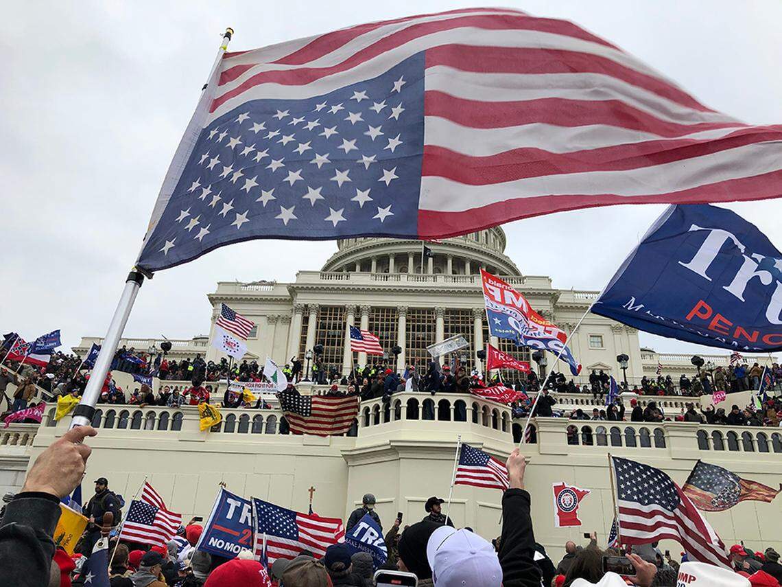 Rioters stand on the West front of the U.S. Capitol in Washington to protest Joe Biden’s election on Jan 6, 2021. The rioters stormed the Capitol and at least five people died, including a police officer and a rioter, during or soon after the attacks.