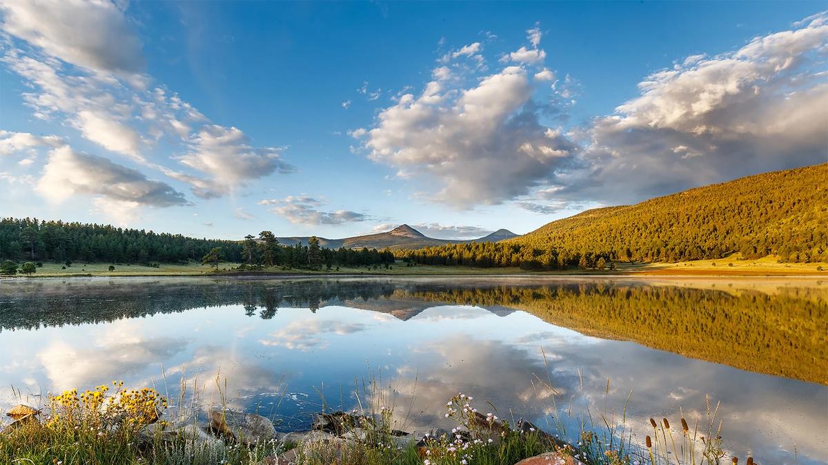 In an undated image provided by Ted Turner Reserves, a lake at Vermejo Park Ranch in Raton, N.M. The media mogul Ted Turner, who died this week, amassed roughly two million acres and revived entire ecosystems. (Ted Turner Reserves via The New York Times) -- NO SALES; FOR EDITORIAL USE ONLY WITH NYT STORY TURNER LAND CONSERVATION BY KAYSEN, DRAPER AND HEALY FOR MAY 7, 2026. ALL OTHER USE PROHIBITED. --