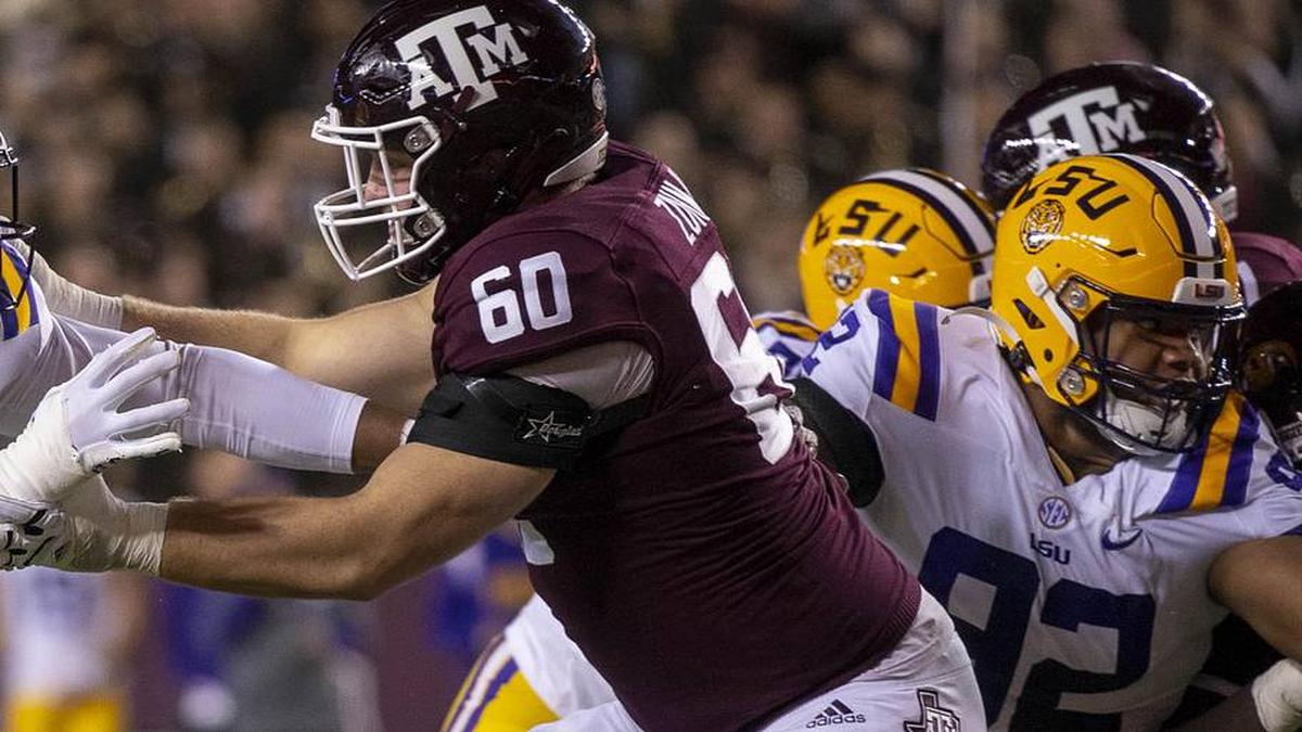  Nov 26, 2022; College Station, Texas, USA; LSU Tigers defensive end BJ Ojulari (18) and Texas A&M Aggies offensive lineman Trey Zuhn III (60) in action during the game between the Texas A&M Aggies and the LSU Tigers at Kyle Field. Mandatory Credit: Jerome Miron-Imagn Images | Jerome Miron-Imagn Images 
