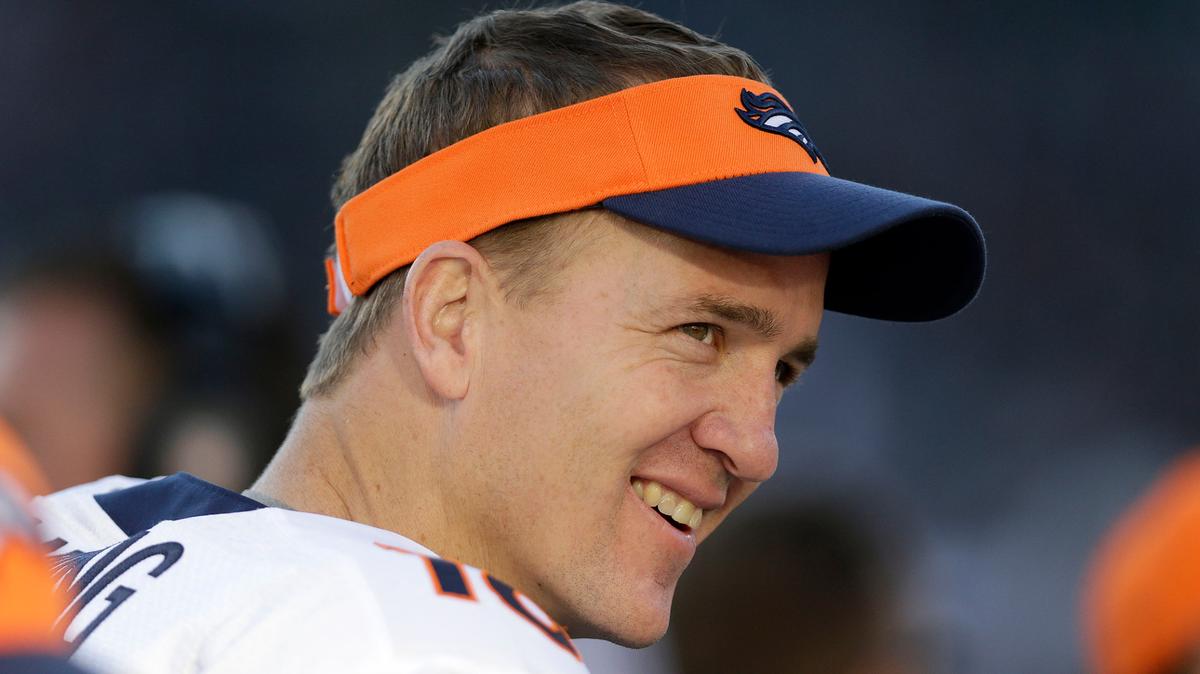 FILE - Denver Broncos quarterback Peyton Manning smiles while standing on the sideline during the second half of an NFL football game against the Oakland Raiders in Oakland, Calif., in this Sunday, Dec. 29, 2013, file photo. Peyton Manning never wanted to leave Indianapolis. But when a neck injury forced him to miss a season and the Colts moved on to Andrew Luck, he couldn’t have landed in a better place than Denver, where he produced a terrific second chapter to his Hall of Fame career. (AP Photo/Marcio Jose Sanchez, File)