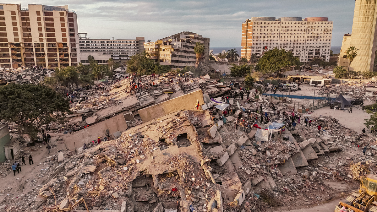 People search for survivors through nine residential buildings that collapsed in last week's earthquakes in La Guaira, Venezuela, on Monday, June 29, 2026. It has been six days since devastating twin earthquakes flattened entire residential neighborhoods in Venezuela, and dozens of new bodies are still being hauled out of the rubble. (Adriana Loureiro Fernandez/The New York Times)
