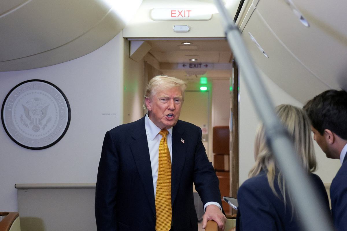 U.S. President Donald Trump speaks to reporters mid-flight in the press cabin of the new, Qatari-gifted Air Force One after changing planes to return to Washington from RAF Mildenhall, Britain, July 8, 2026. REUTERS/Jonathan Ernst