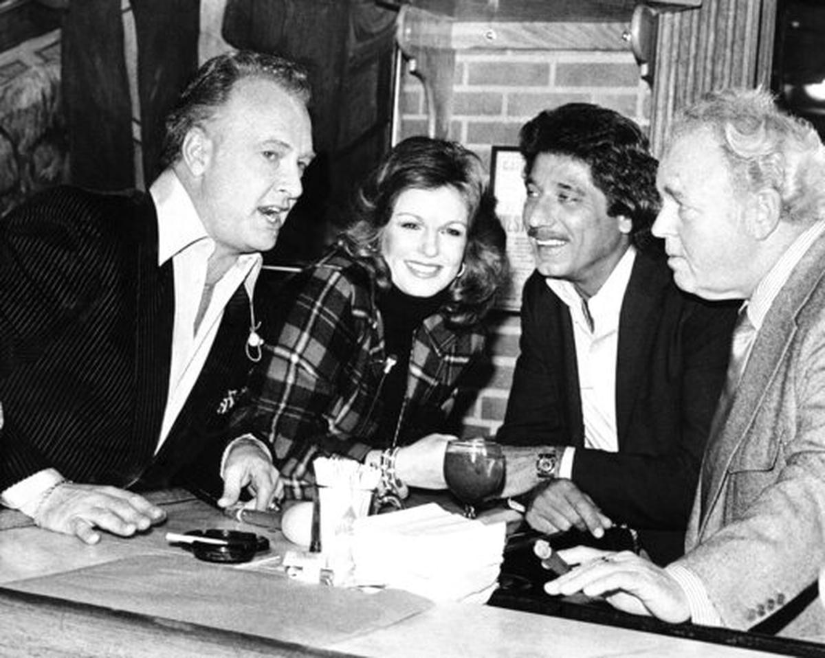 Paul Horning, Phyllis George, Joe Namath and Carroll O’Connor are seen in Beverly Hills, California, at a pregame Super Bowl taping in 1980. George, the former Miss America who became a female sportscasting pioneer on CBS’s “The NFL Today” and served as the first lady of Kentucky, died on May 14. She was 70.