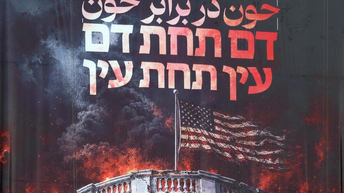 An anti-US billboard features a sentence in Persian that reads "Blood for Blood" hangs at Palestine Square in Tehran, Iran, Photo by Abedin Taherkenareh/EPA