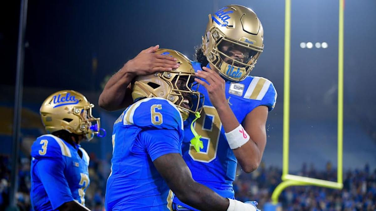  Nov 8, 2025; Pasadena, California, USA; UCLA Bruins running back Anthony Woods (6) celebrates his touchdown scored against the Nebraska Cornhuskers with quarterback Nico Iamaleava (9) during the second half at the Rose Bowl. Mandatory Credit: Gary A. Vasquez-Imagn Images | Gary A. Vasquez-Imagn Images 