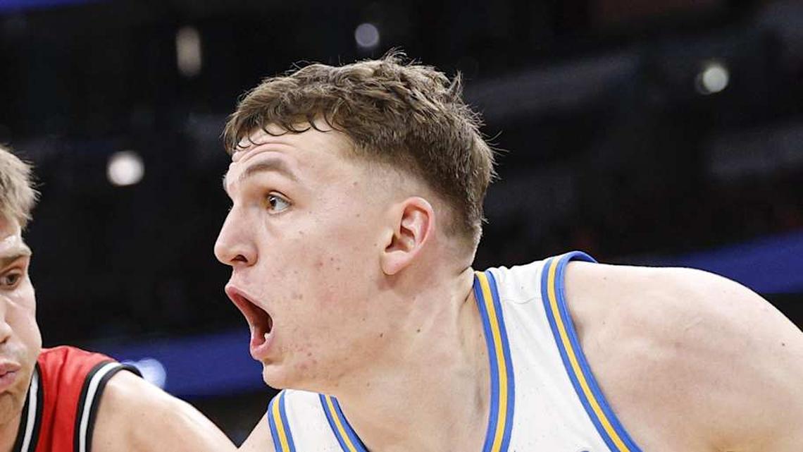  Mar 12, 2026; Chicago, IL, USA; UCLA Bruins forward Tyler Bilodeau (34) drives to the basket against Rutgers Scarlet Knights guard Harun Zrno (13) during the second half at United Center. Mandatory Credit: Kamil Krzaczynski-Imagn Images | Kamil Krzaczynski-Imagn Images 