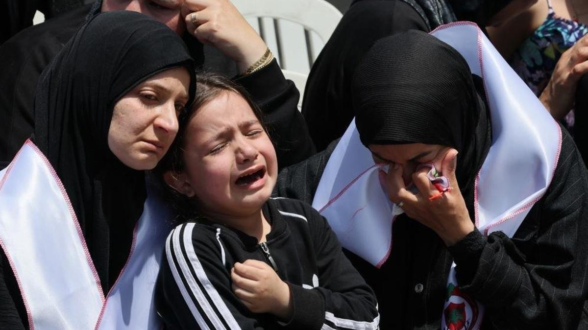 People mourn during a funeral procession for two members of the Lebanese Civil Defense in the southern coastal city of Sidon on Wednesday. The two were killed in an Israeli airstrike in Nabatieh, southern Lebanon, a day earlier. Photo by Wael Hamzeh/EPA