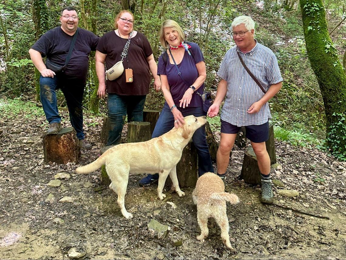 Happy truffle hunters reward their canine friends after a hunt. Photo credit: Karlic Tartufi