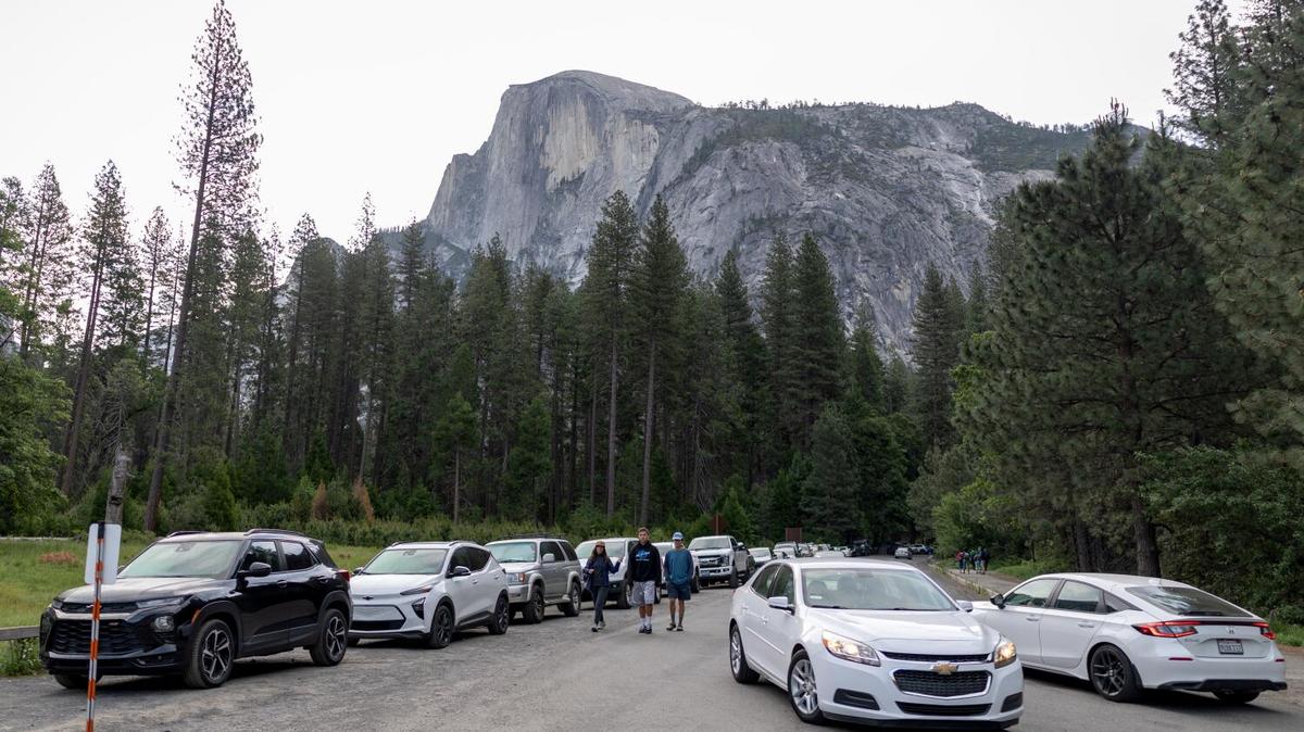 People look for parking near Curry Village in Yosemite National Park on Saturday, May 16, 2026, in Yosemite, California. The National Park Service announced it will be doing away with summer reservation requirements at several popular parks, including Yosemite, leading to a surge in crowds. (Eric Thayer/Los Angeles Times/TNS)