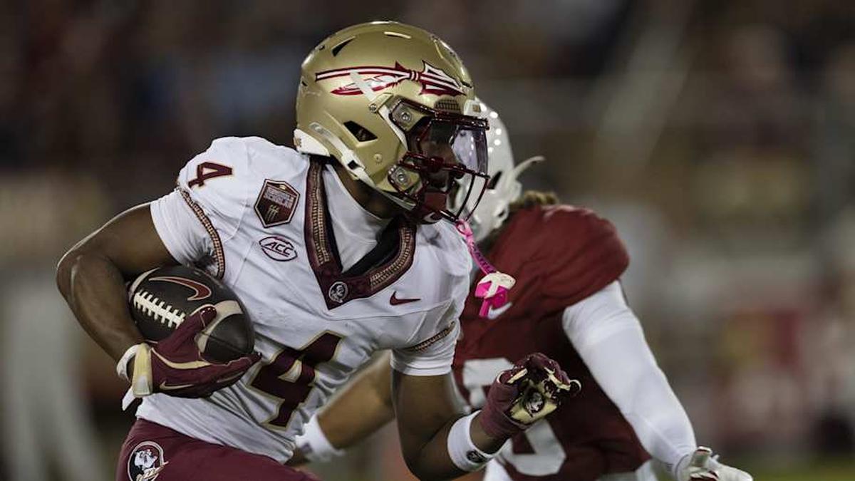  Oct 18, 2025; Stanford, California, USA; Florida State Seminoles wide receiver Squirrel White (4) runs with the ball during the third quarter against the Stanford Cardinal at Stanford Stadium. Mandatory Credit: Stan Szeto-Imagn Images | Stan Szeto-Imagn Images 