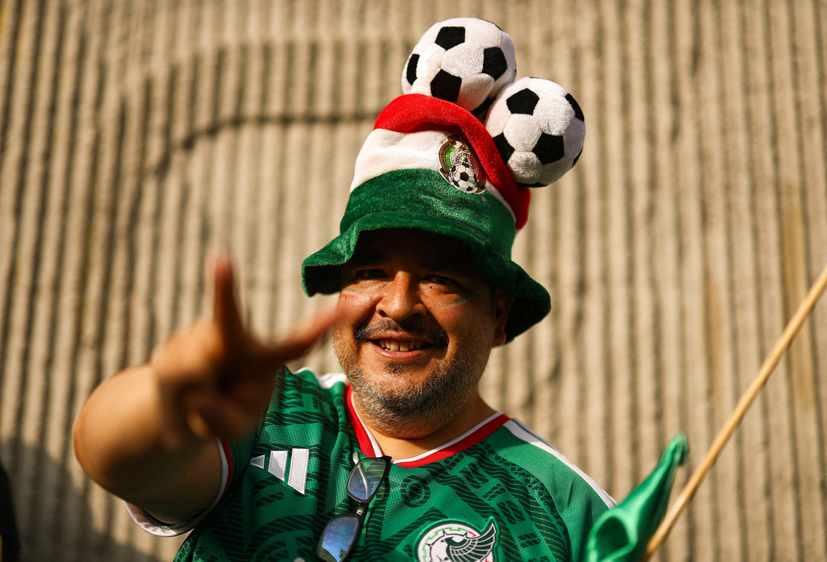 Soccer Football - FIFA World Cup 2026 - Group A - Mexico v South Africa - Estadio Azteca, Mexico City, Mexico - June 11, 2026 A Mexico fan poses for a photograph outside the stadium before the match REUTERS/Hannah Mckay