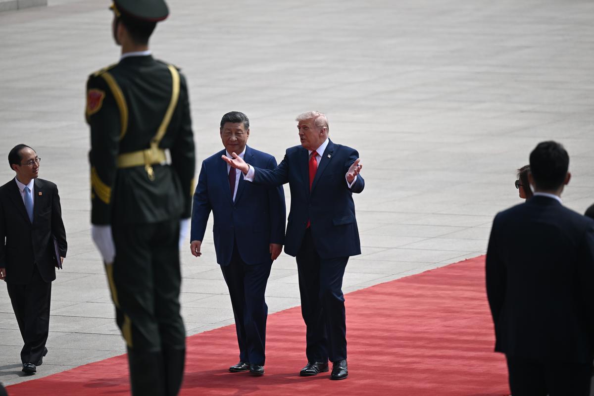 President Xi Jinping of China and President Donald Trump walk together as they arrived to the Great Hall of the People in Beijing during their two-day summit, on Thursday, May 14, 2026. During the first U.S. presidential visit to China in nearly a decade, Xi delivered a warning on Taiwan, saying that the issue, if handled poorly, could lead to conflict and "an extremely dangerous situation." (Kenny Holston/The New York Times)..