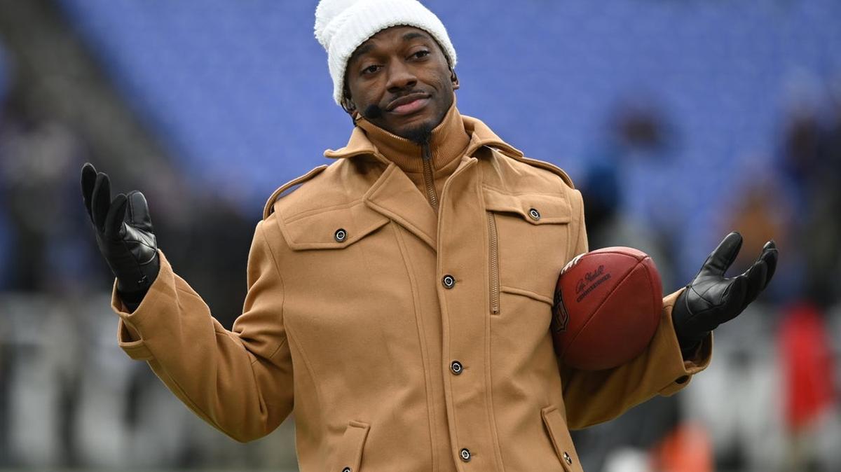 
                   Jan 20, 2024; Baltimore, MD, USA; ESPN college football and NFL analyst Robert Griffin III reacts on the sidelines before a 2024 AFC divisional round game between the Houston Texans and the Baltimore Ravens at M&T Bank Stadium. Mandatory Credit: Tommy Gilligan-Imagn Images 
                
