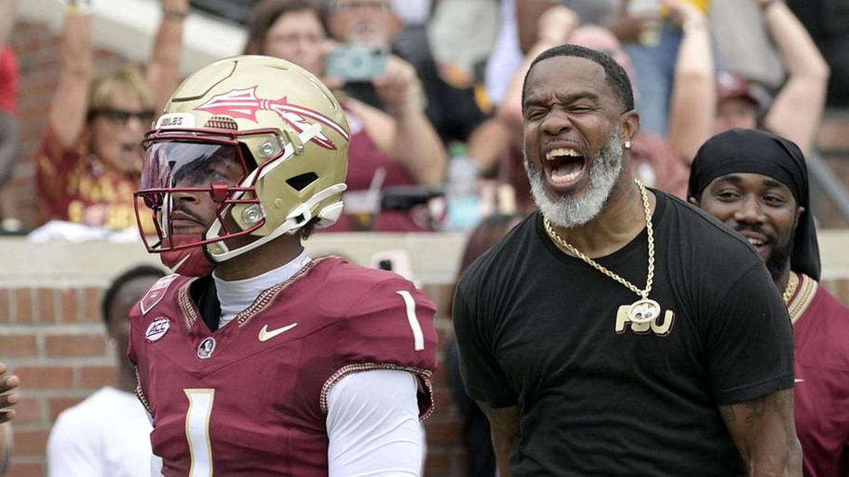  Aug 30, 2025; Tallahassee, Florida, USA; Florida State Seminoles quarterback Tommy Castellanos (1) celebrates with Peter Warrick (back) after scoring a touchdown against the Alabama Crimson Tide during the first half at Doak S. Campbell Stadium. Mandatory Credit: Melina Myers-Imagn Images | Melina Myers-Imagn Images 