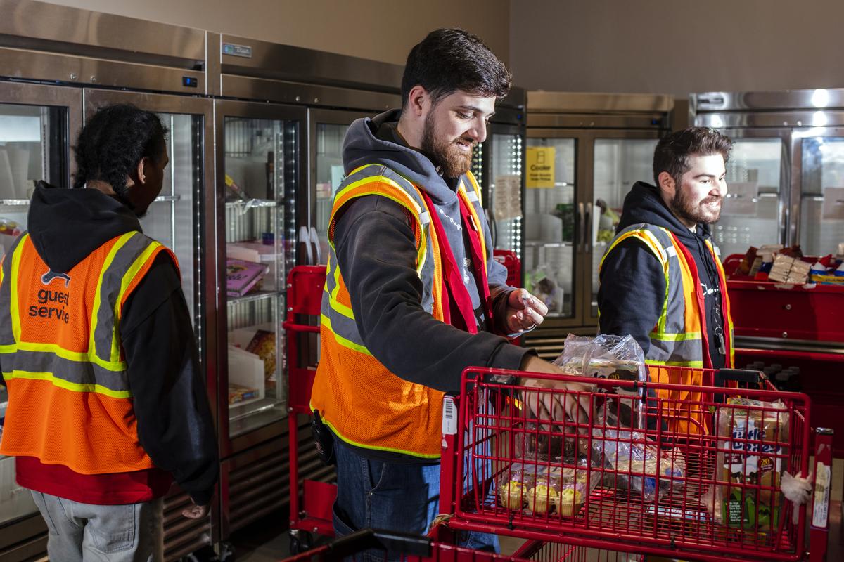 Workers in a backroom at a renovated Target store in Paramus, N.J., on April 7, 2026. The backrooms have been redesigned to make it easier for employees to prepare items for pickup. (Bryan Anselm/The New York Times)