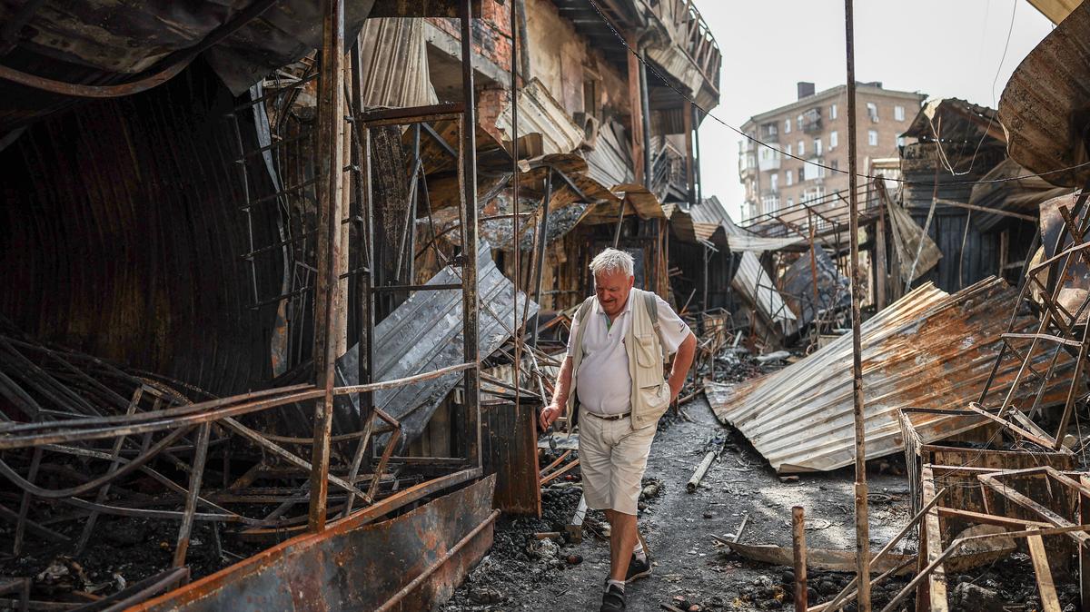 A man walks through debris of a demolished market, which was hit during yesterday's Russian missile and drone attack, amid Russia's attack on Ukraine, in Kyiv, Ukraine, May 25, 2026. REUTERS/Alina Smutko