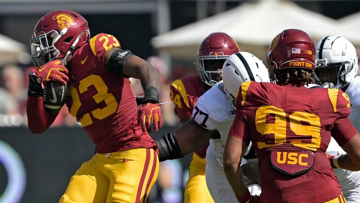  Oct 12, 2024; Los Angeles, California, USA; USC Trojans linebacker Desman Stephens II (23) runs the ball after an interception in the first half against the Penn State Nittany Lions at United Airlines Field at the Los Angeles Memorial Coliseum. Mandatory Credit: Jayne Kamin-Oncea-Imagn Images | Jayne Kamin-Oncea-Imagn Images 