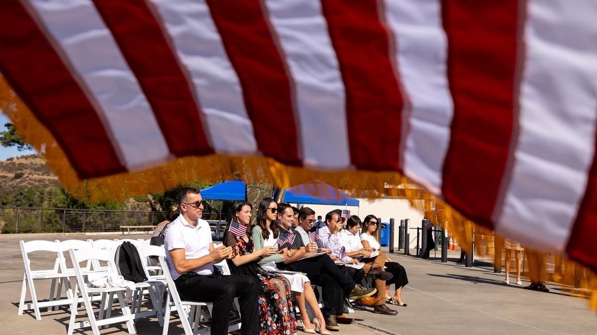 U.S. Citizenship and Immigration Services welcomes a small group of new U.S. citizens during a special naturalization ceremony on the Hollywood Sign Terrace at Griffith Observatory on Monday, Oct. 21, 2024, in Los Angeles. (Brian van der Brug/Los Angeles Times/TNS)