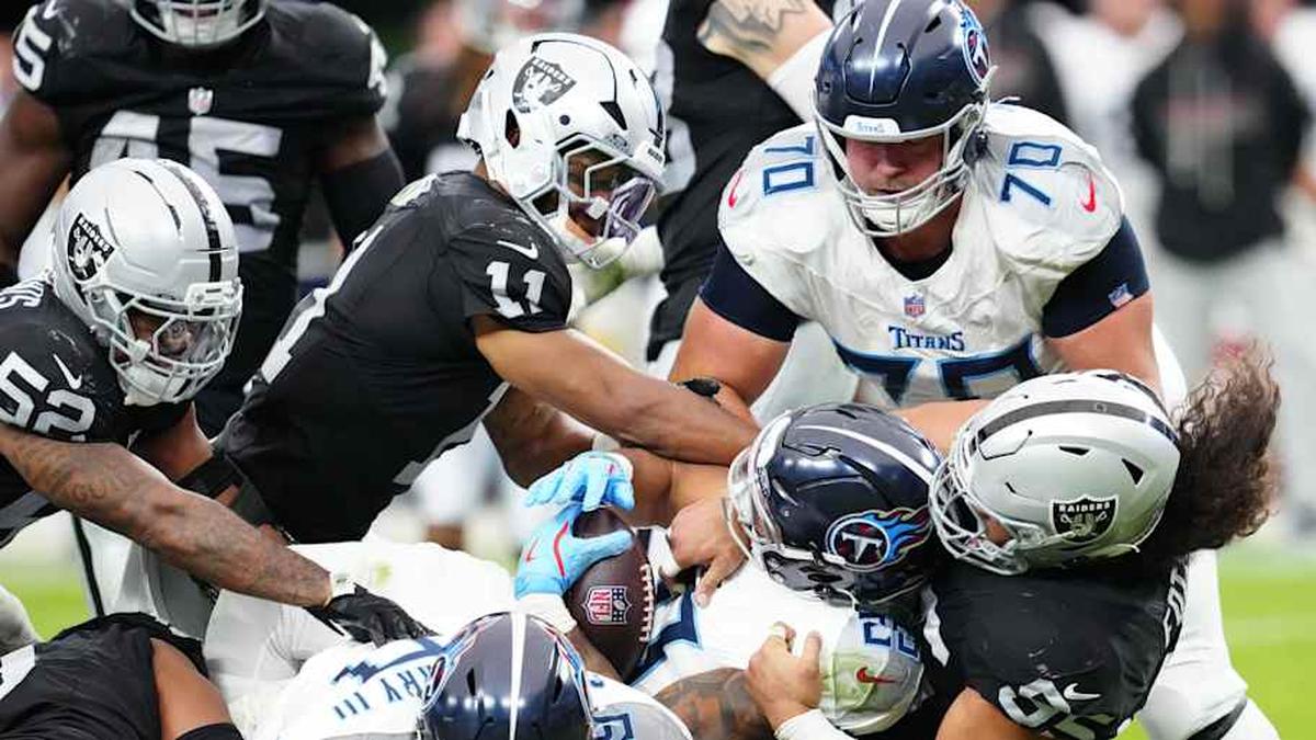  Oct 12, 2025; Paradise, Nevada, USA; Tennessee Titans running back Tony Pollard (20) is tackled during the second half against the Las Vegas Raiders at Allegiant Stadium. Mandatory Credit: Stephen R. Sylvanie-Imagn Images | Stephen R. Sylvanie-Imagn Images 