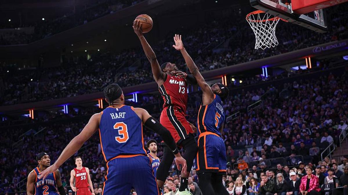  Jan 27, 2024; New York, New York, USA; Miami Heat center Bam Adebayo (13) drives for a shot as New York Knicks forward Precious Achiuwa (5) and guard Josh Hart (3) during the first half at Madison Square Garden. Mandatory Credit: Vincent Carchietta-Imagn Images | Vincent Carchietta-Imagn Images 